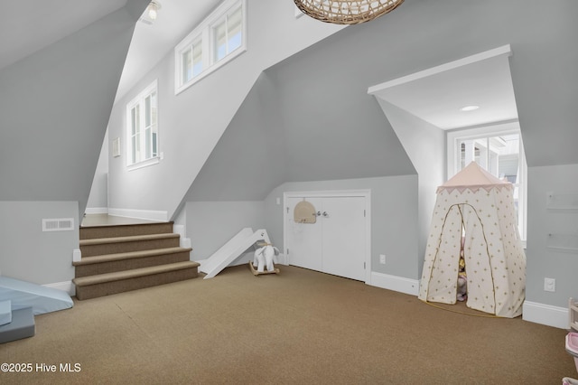6221 Chalfont Cir, Wilmington, NC 28405 - additional living space with carpet floors, baseboards, visible vents, and vaulted ceiling
