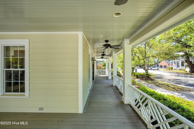 114 N Atlantic Ave, Southport, NC 28461 - wooden porch featuring a ceiling fan