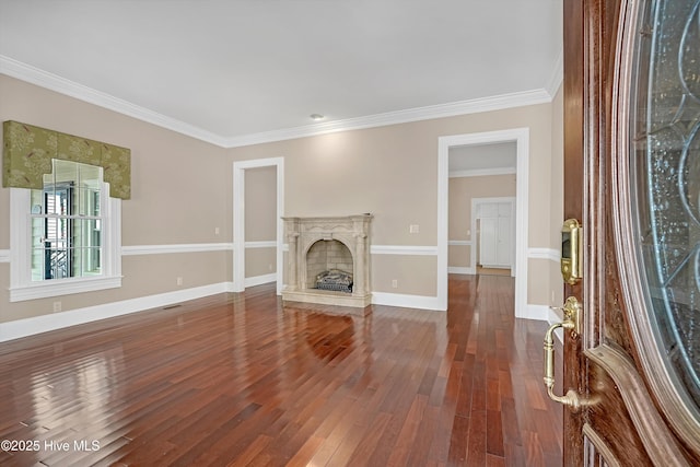 114 N Atlantic Ave, Southport, NC 28461 - unfurnished living room with dark wood finished floors, crown molding, a fireplace, and baseboards