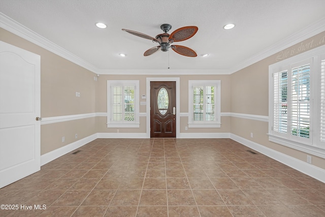 114 N Atlantic Ave, Southport, NC 28461 - tiled entrance foyer featuring a ceiling fan, baseboards, ornamental molding, and recessed lighting