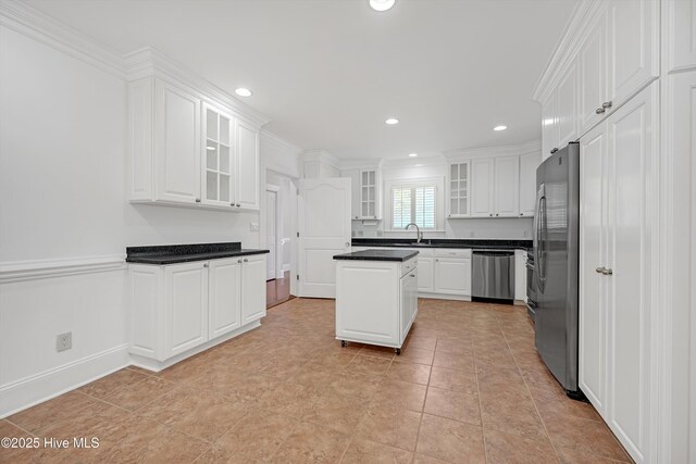 114 N Atlantic Ave, Southport, NC 28461 - kitchen with appliances with stainless steel finishes, white cabinets, a sink, dark countertops, and recessed lighting