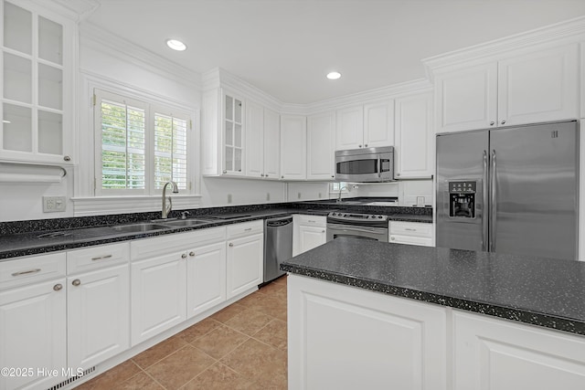 114 N Atlantic Ave, Southport, NC 28461 - kitchen with appliances with stainless steel finishes, white cabinets, glass insert cabinets, recessed lighting, and light tile patterned floors