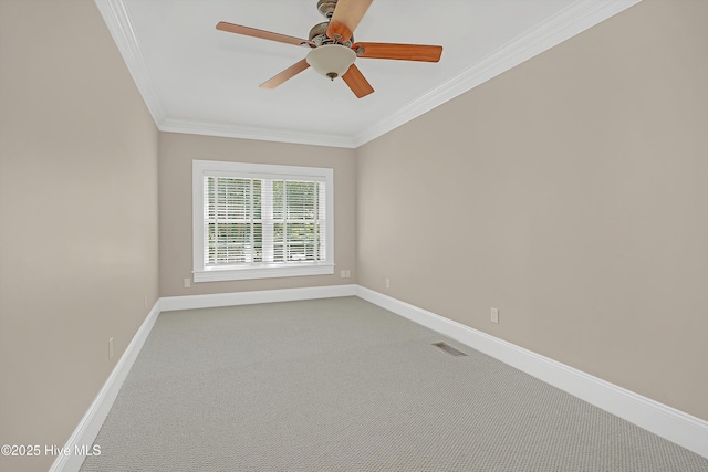 114 N Atlantic Ave, Southport, NC 28461 - empty room with ornamental molding, carpet floors, baseboards, and ceiling fan