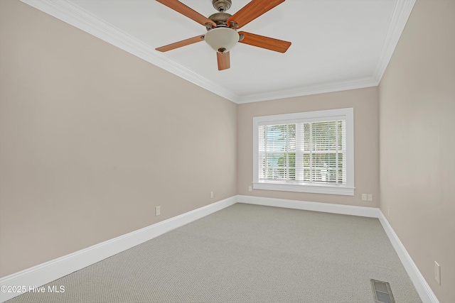 114 N Atlantic Ave, Southport, NC 28461 - carpeted spare room with crown molding, baseboards, and a ceiling fan