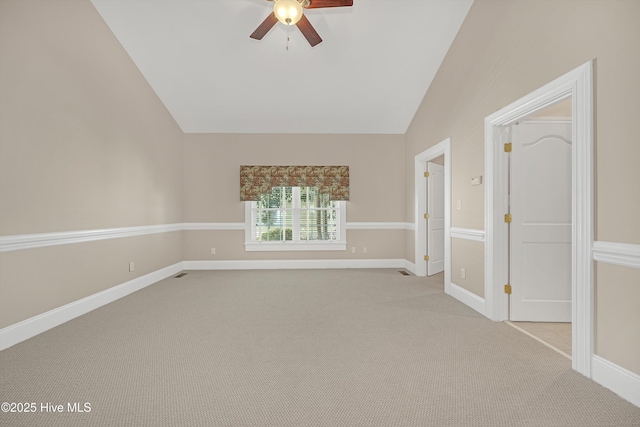114 N Atlantic Ave, Southport, NC 28461 - empty room featuring lofted ceiling, a ceiling fan, light carpet, and baseboards