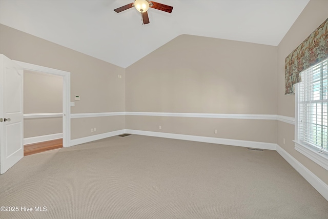 114 N Atlantic Ave, Southport, NC 28461 - empty room with a ceiling fan, lofted ceiling, carpet flooring, and baseboards
