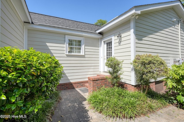 114 N Atlantic Ave, Southport, NC 28461 - doorway to property featuring a shingled roof