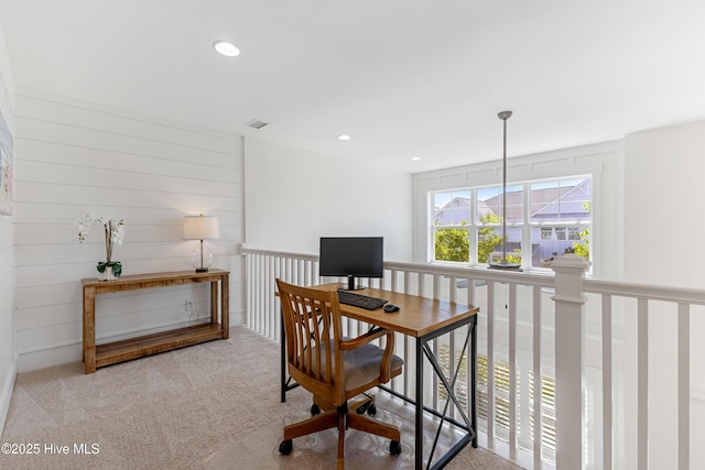 carpeted office with recessed lighting
