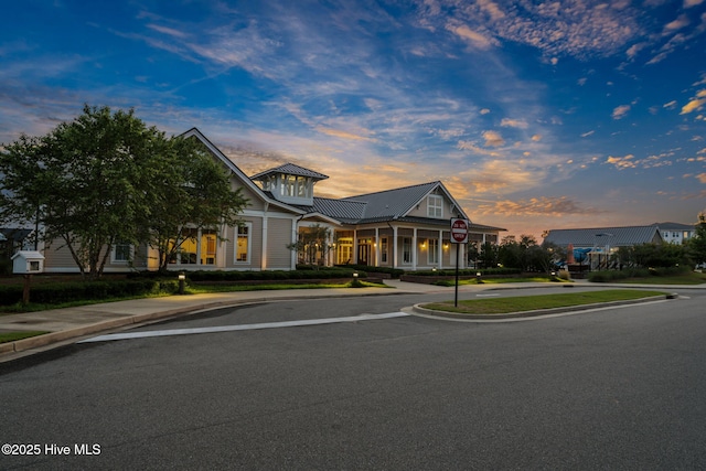 view of front of home featuring a porch and metal roof