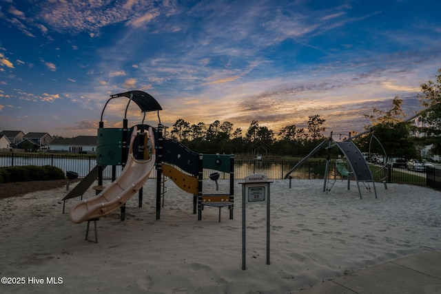 playground at dusk with fence and playground community