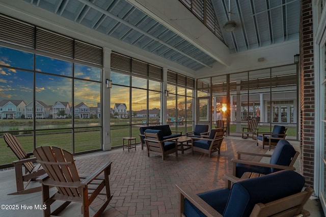exterior space with a residential view, a water view, outdoor lounge area, and beamed ceiling