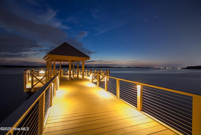 view of dock with a water view and a gazebo