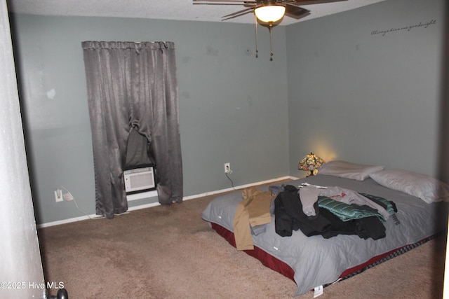 bedroom featuring ceiling fan, baseboards, and carpet