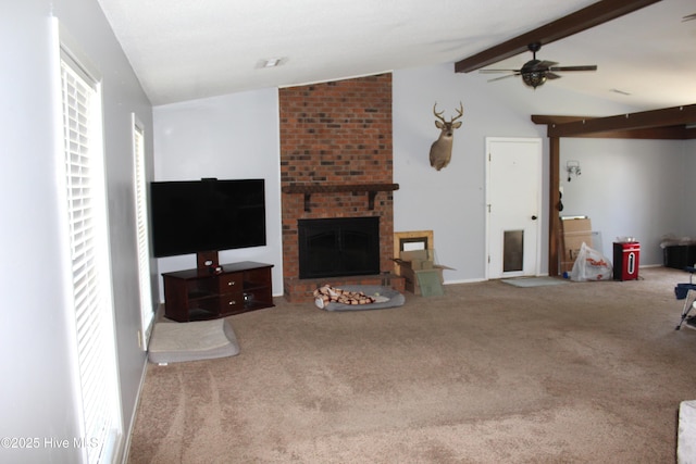 living room with a fireplace, carpet floors, ceiling fan, and lofted ceiling with beams