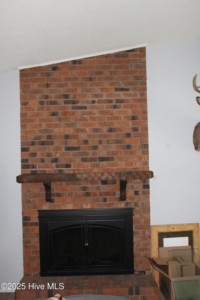 interior details with a brick fireplace
