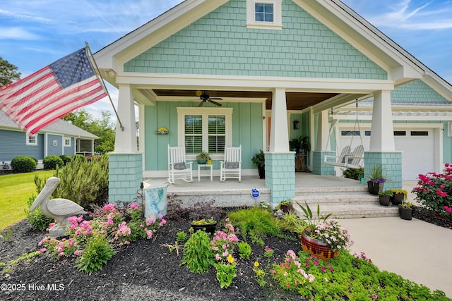 1007 Softwind Way, Southport, NC 28461 - view of front of property with a porch, board and batten siding, ceiling fan, and an attached garage