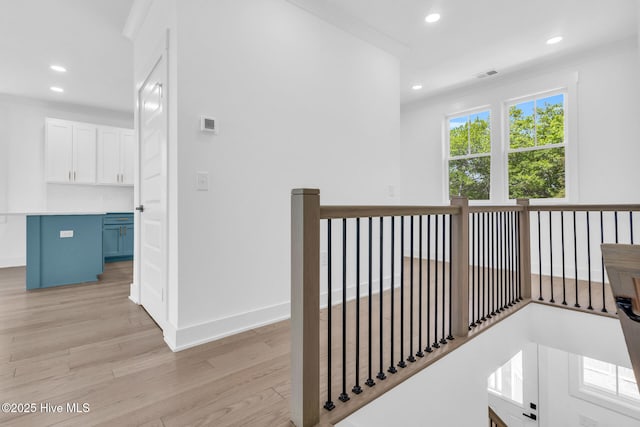 110 SW 26th St, Oak Island, NC 28465 - hall featuring light wood-style floors, an upstairs landing, recessed lighting, and visible vents