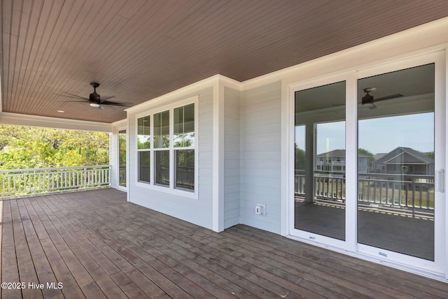110 SW 26th St, Oak Island, NC 28465 - deck featuring a ceiling fan