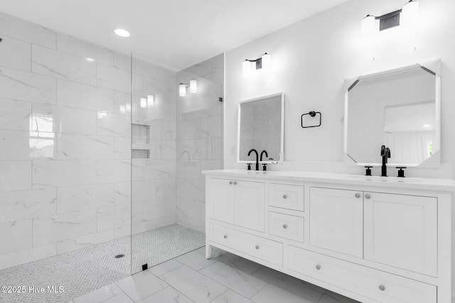 110 SW 26th St, Oak Island, NC 28465 - bathroom featuring a sink, walk in shower, double vanity, and marble finish floor
