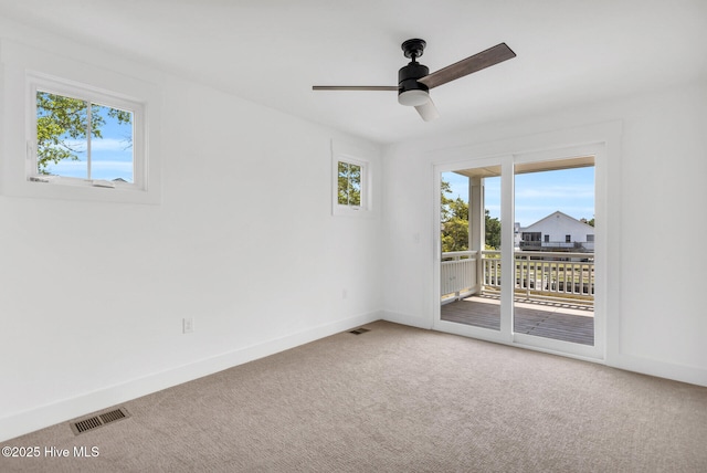 110 SW 26th St, Oak Island, NC 28465 - carpeted empty room featuring visible vents, a ceiling fan, and baseboards