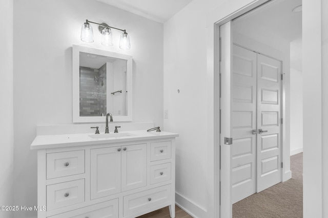 110 SW 26th St, Oak Island, NC 28465 - full bathroom with vanity, baseboards, and tiled shower