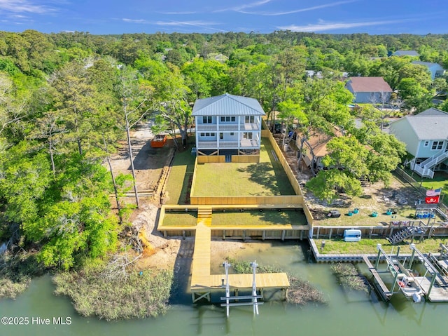 110 SW 26th St, Oak Island, NC 28465 - drone / aerial view with a water view and a view of trees