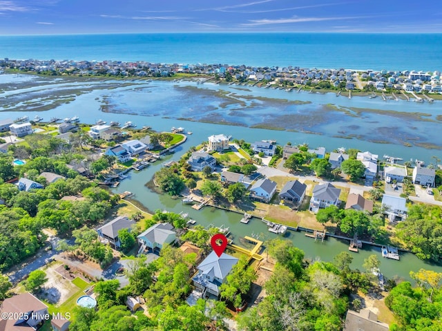 110 SW 26th St, Oak Island, NC 28465 - drone / aerial view with a water view and a residential view