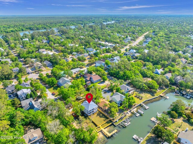 110 SW 26th St, Oak Island, NC 28465 - bird's eye view with a water view, a residential view, and a wooded view