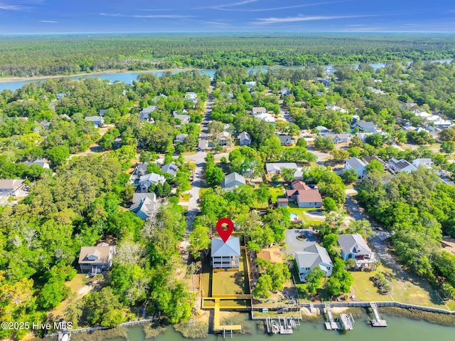 110 SW 26th St, Oak Island, NC 28465 - birds eye view of property featuring a water view, a view of trees, and a residential view