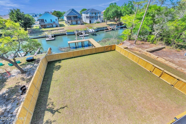110 SW 26th St, Oak Island, NC 28465 - dock area featuring a water view, fence, and a residential view