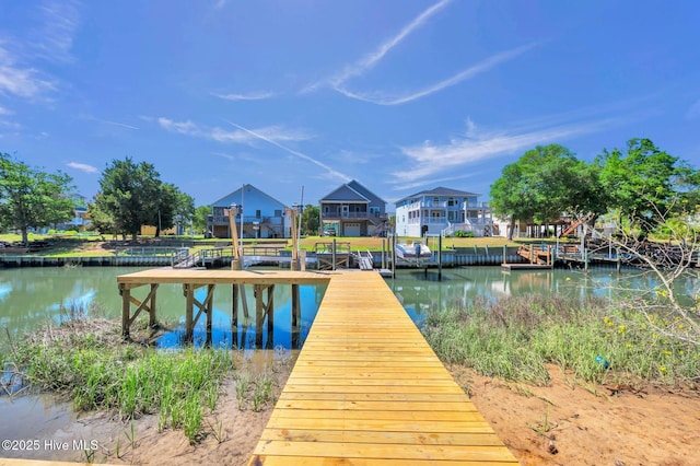 110 SW 26th St, Oak Island, NC 28465 - dock area featuring a water view and a residential view