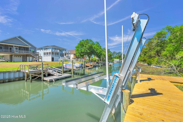 110 SW 26th St, Oak Island, NC 28465 - view of dock featuring a water view and boat lift