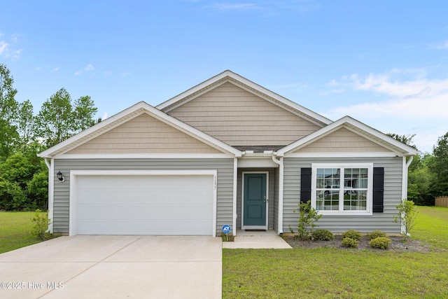single story home featuring a front yard, concrete driveway, and an attached garage