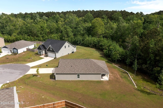 drone / aerial view with a view of trees