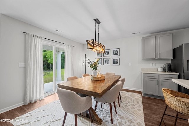1157 Carteret Manor Dr, Jacksonville, NC 28546 - dining area with wood finished floors and baseboards