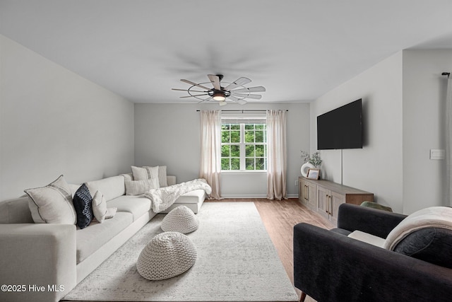 1157 Carteret Manor Dr, Jacksonville, NC 28546 - living room featuring light wood-type flooring, ceiling fan, and baseboards