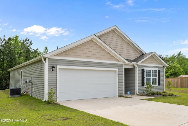 single story home with a front lawn, central AC, an attached garage, and fence