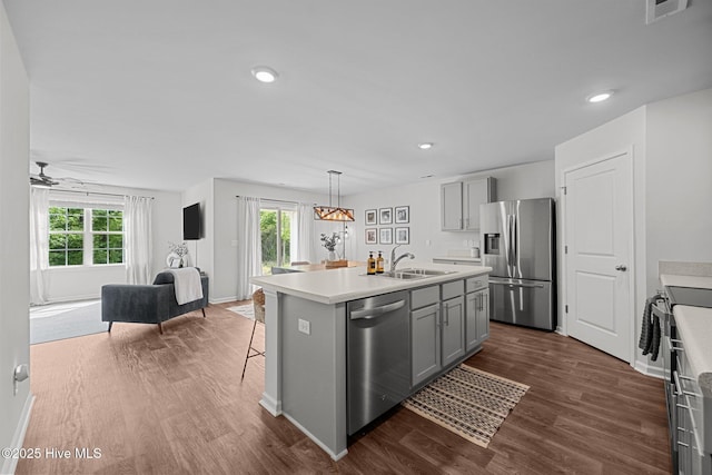 kitchen with gray cabinetry, visible vents, appliances with stainless steel finishes, and plenty of natural light