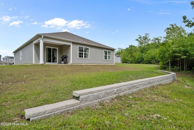 1157 Carteret Manor Dr, Jacksonville, NC 28546 - back of house featuring a yard