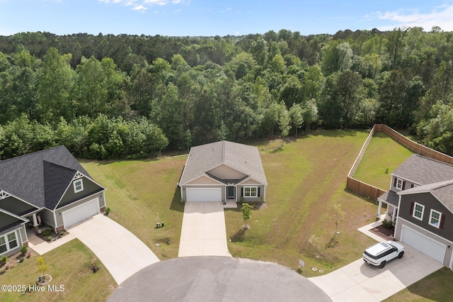 aerial view featuring a wooded view