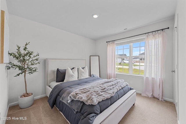 bedroom featuring visible vents, baseboards, and carpet floors