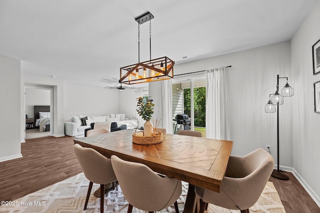 1157 Carteret Manor Dr, Jacksonville, NC 28546 - dining space with a chandelier, wood finished floors, and baseboards