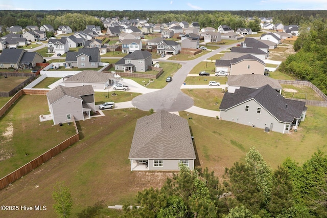 birds eye view of property with a residential view