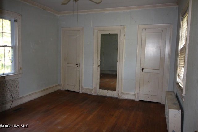 unfurnished bedroom with crown molding, visible vents, and wood finished floors