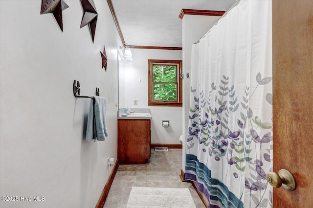720 Swains Mill Rd, Harrellsville, NC 27942 - bathroom with baseboards, crown molding, vanity, a shower with shower curtain, and toilet