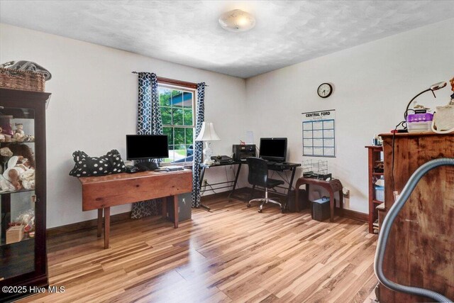 720 Swains Mill Rd, Harrellsville, NC 27942 - office featuring wood finished floors, baseboards, and a textured ceiling
