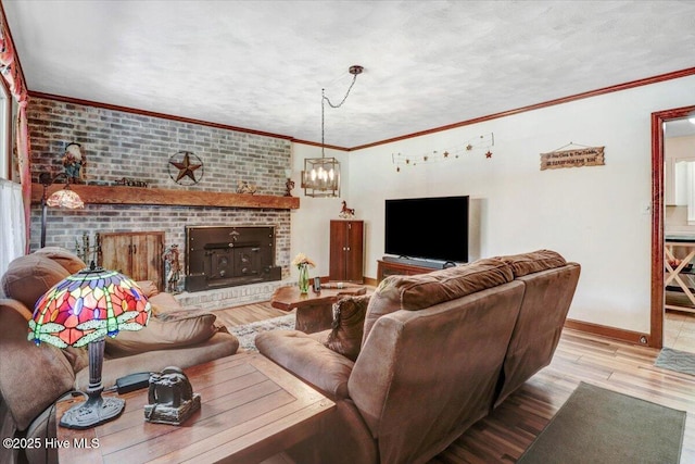 720 Swains Mill Rd, Harrellsville, NC 27942 - living room with a fireplace, wood finished floors, baseboards, a chandelier, and ornamental molding