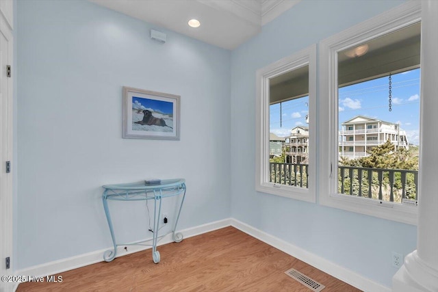 3720 Island Dr, North Topsail Beach, NC 28460 - empty room featuring visible vents, baseboards, and wood finished floors