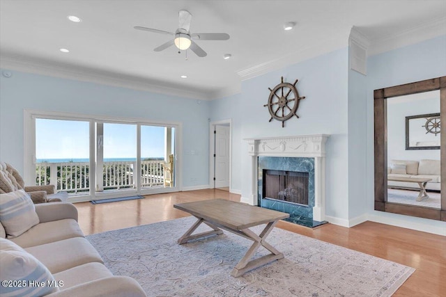 3720 Island Dr, North Topsail Beach, NC 28460 - living room with a high end fireplace, baseboards, ornamental molding, and wood finished floors