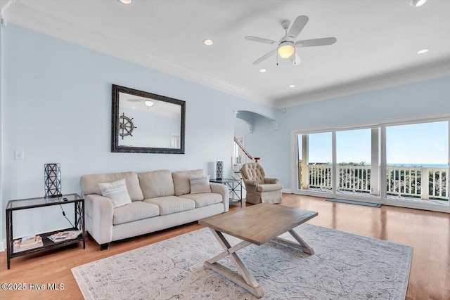 3720 Island Dr, North Topsail Beach, NC 28460 - living area featuring a ceiling fan, ornamental molding, wood finished floors, recessed lighting, and arched walkways